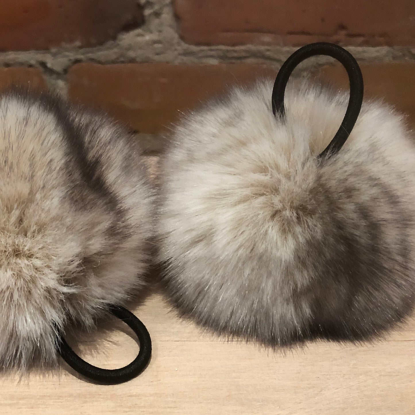 fabric covered loop attachments on beige faux fur poms