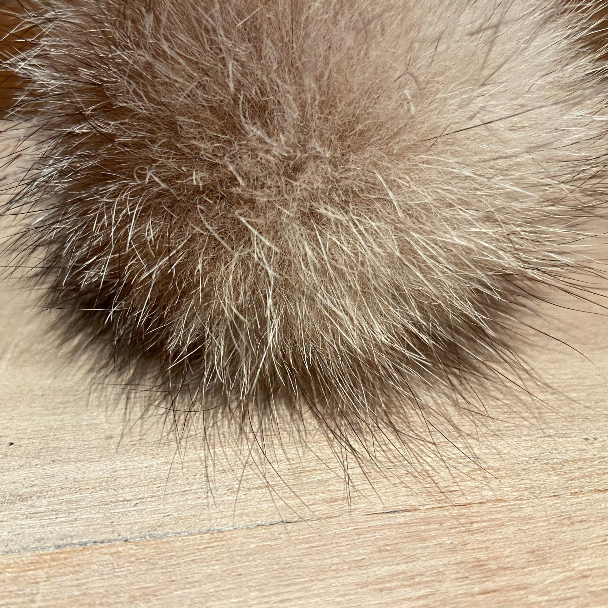 Close View of Beige and Cream Upcycled Vintage Fox Fur Pom