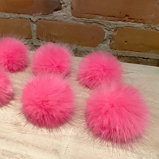 Set of 12 two-inch mini hot pink faux fur pom poms