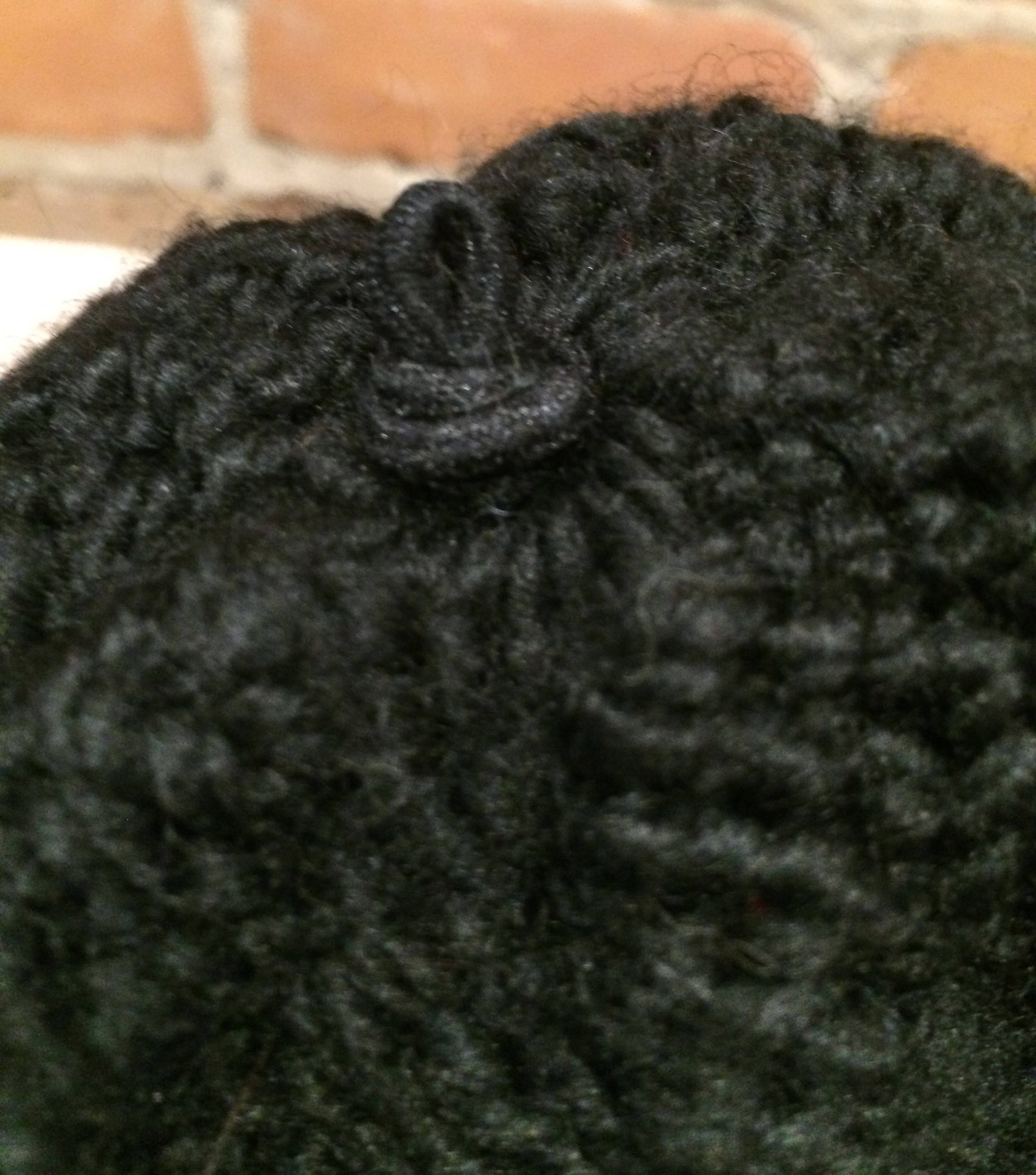 View of Elastic Loop Attachment Knot Inside Winter Knit Hat