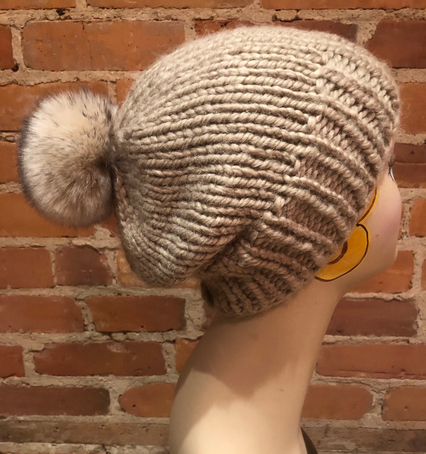 Beige and Black Pom Pom on Beige Winter Knit Hat, Side View